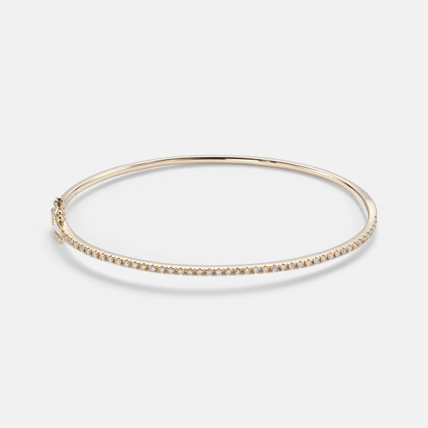 Single Row 18kt yellow gold bracelet with diamonds