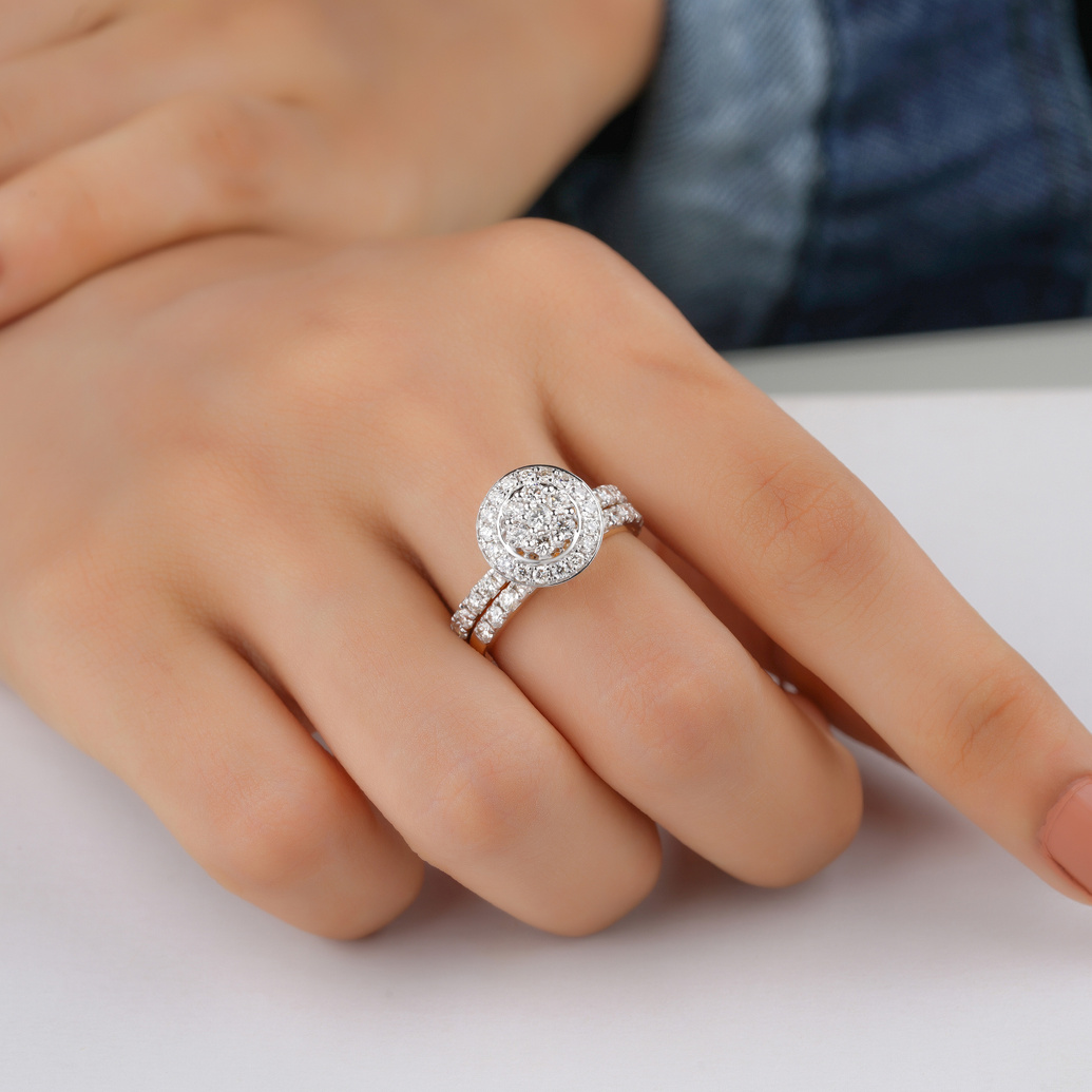 Person Wearing a Ring with Diamonds